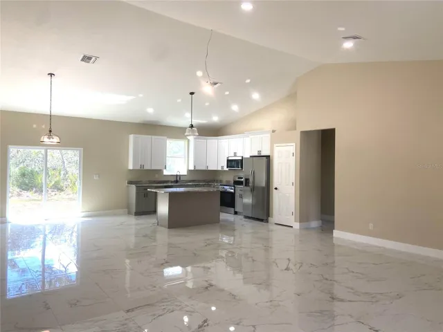 Great room to kitchen, porcelain tile flooring