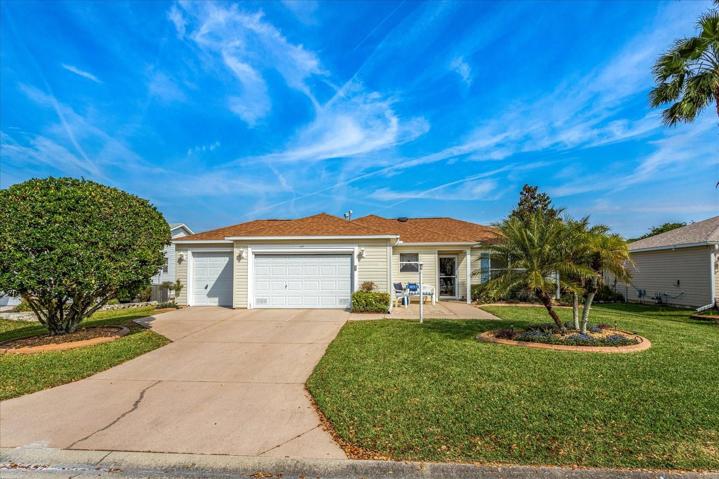 Front Elevation of 2475 Cherokee w/ Palm Trees, Cement Coping & Front Patio