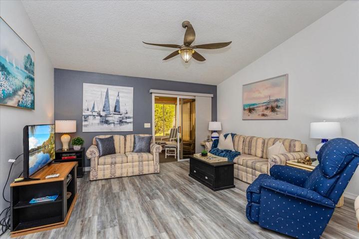 Living Room w/ Vaulted Ceiling, New Light/Fan and Luxury Vinyl Plank Flooring Throughout, Entire Interior Freshly Painted