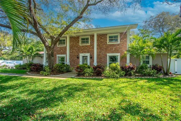 This exquisite executive home is a rare jewel, occupying a generous .58-acre lot adorned with verdant landscaping, dramatic outdoor lighting, and an awe-inspiring canopy of mature trees, creating a sanctuary of serene beauty and unparalleled privacy.