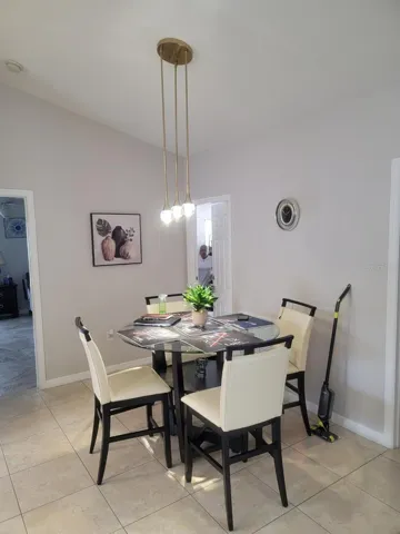 dining with designer drop lights