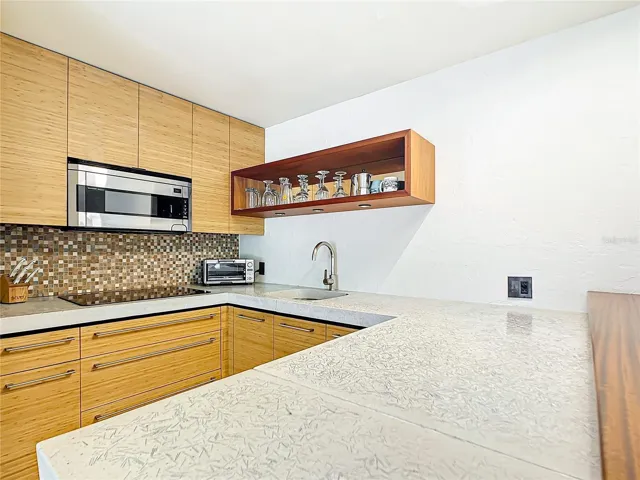 Closer view of the kitchenette- Notice the counters? This is a custom made concrete counter-top.