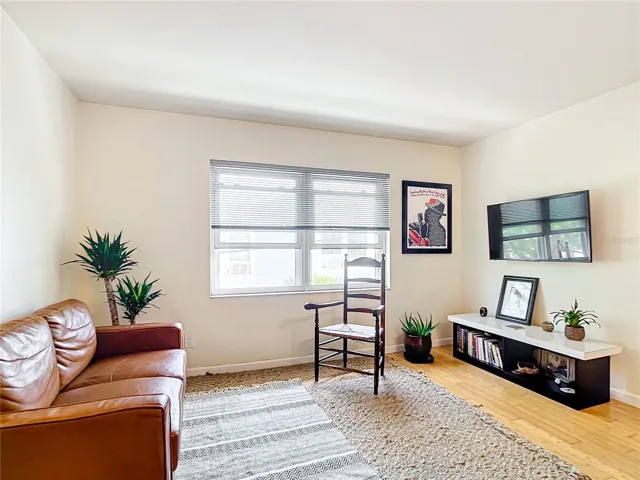 Living room with updated windows. It's nice & bright!