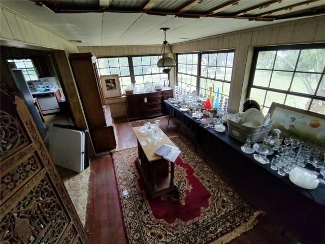 Sunroom with views of Silver Lake and front yard