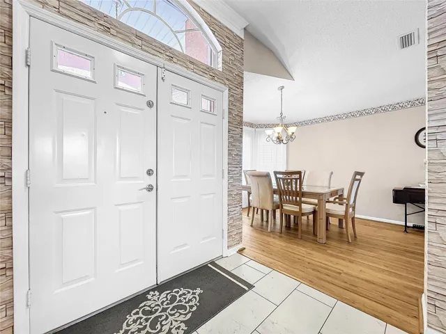Tiled entrance into the foyer