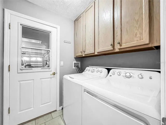 Laundry Room with upper cabinets
