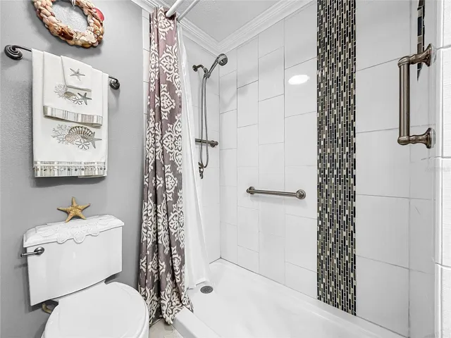 Floor to ceiling tiled shower