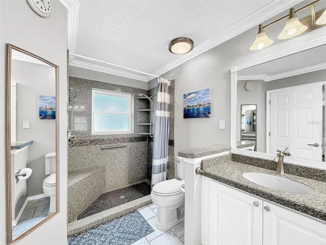 Remodeled master bathroom with tiled shower