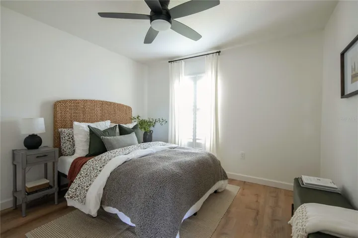 3rd bedroom offers Plantation Shutters and a remote-controlled fan.