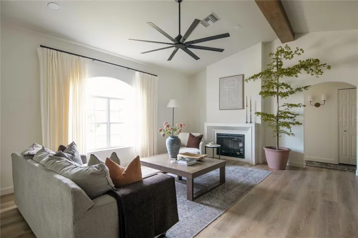 This particular fireplace boasts a traditional electric design with a three-sided interior brick wall, glass door, and mesh screen, providing a realistic look without the inconvenience of cleaning dust or ashes.
