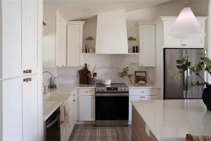 English Inspired Kitchen- blending charm with modern functionality. Kitchen Maid cabinetry on the outer wall w/ 42