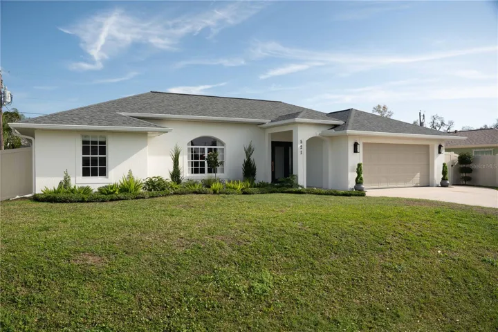 Vinyl fence surround the entire property with wide gates on both side.