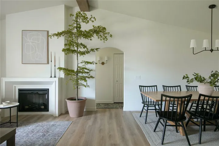 The interior has an inviting open and split floor plan, thoughtfully designed to create distinct spaces while maintaining a seamless flow.