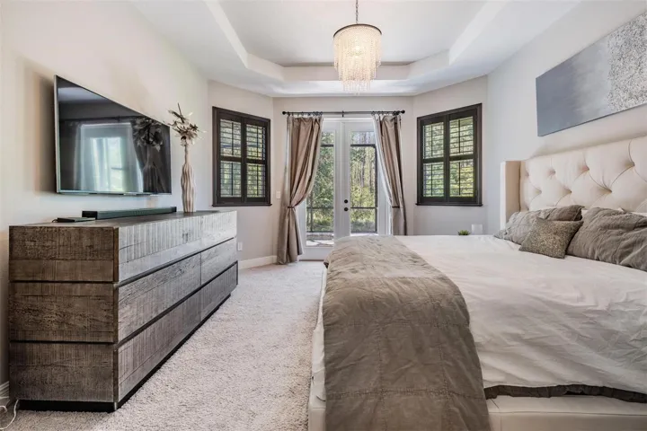 Master bedroom with a designer trey ceiling