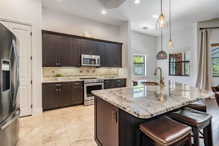 Large kitchen with eat in area and breakfast bar seating