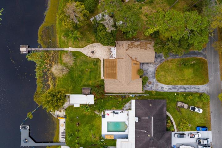 Arial view.  How many cars can you fit in that driveway on top of the cars you can fit in the garage