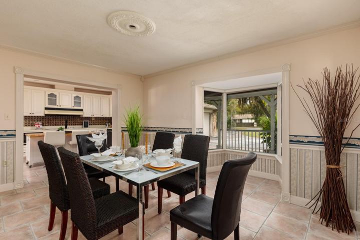 Formal dining room right off the kitchen with a bay window