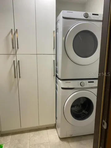 Laundry room with cabinets.