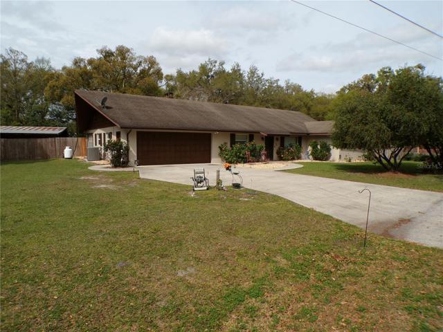 Front of home. Notice very large parking driveway.