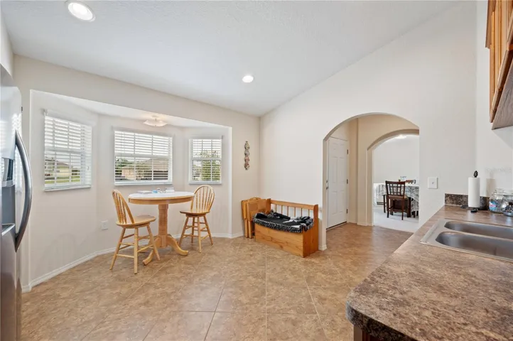 In the kitchen looking at the breakfast nook by the front windows