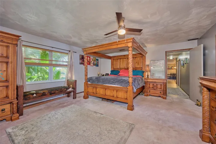 Reverse of master bedroom with view down hallway