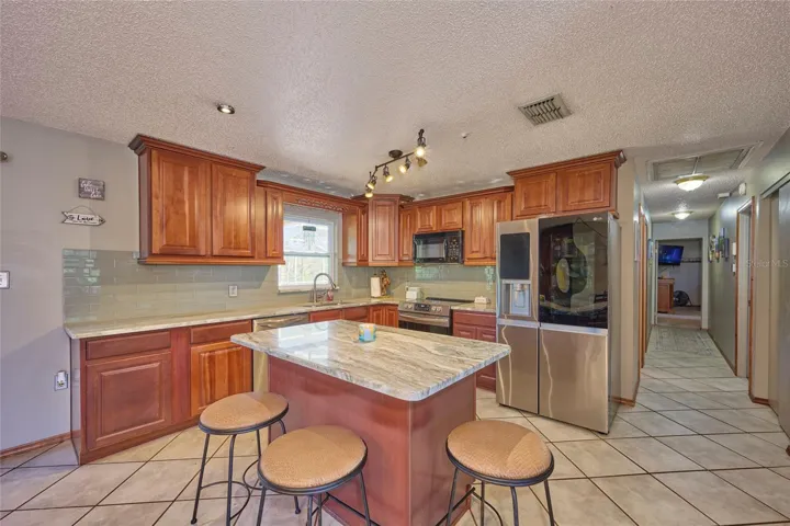 Kitchen with view of hallway leading to bedrooms