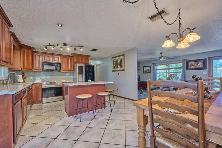 Kitchen with view of dining area and living room