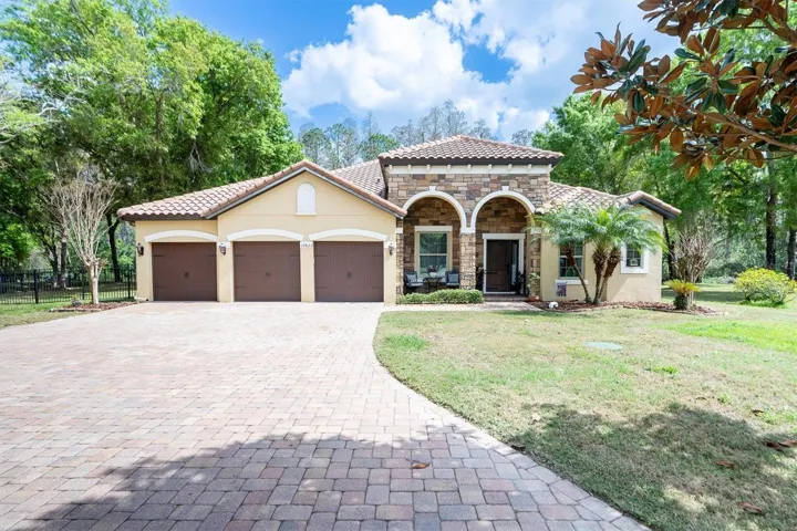 Front of home with 3 car garage