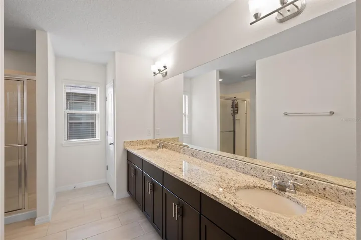 Master bath with dual sinks and granite counters! Huge walk in closet!