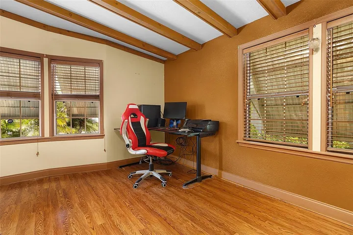 Spacious Living Room with High Beam Ceiling