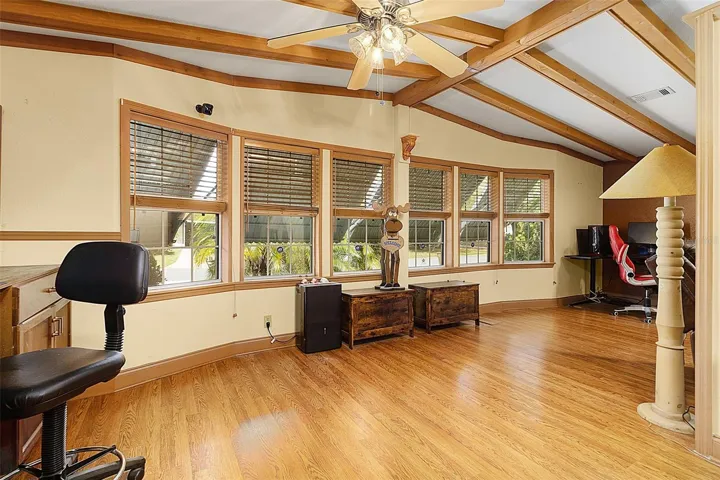 Spacious Living Room with High Beam Ceiling