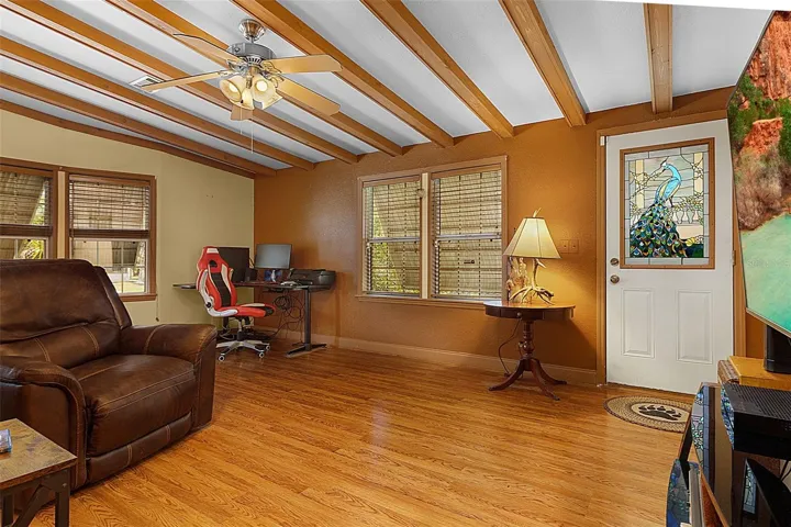 Spacious Living Room with High Beam Ceiling