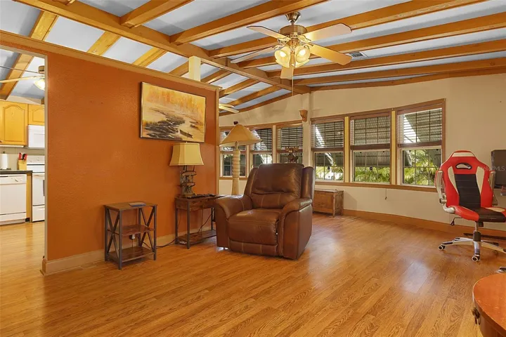 Spacious Living Room with High Beam Ceiling