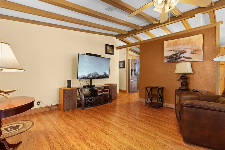 Spacious Living Room with High Beam Ceiling