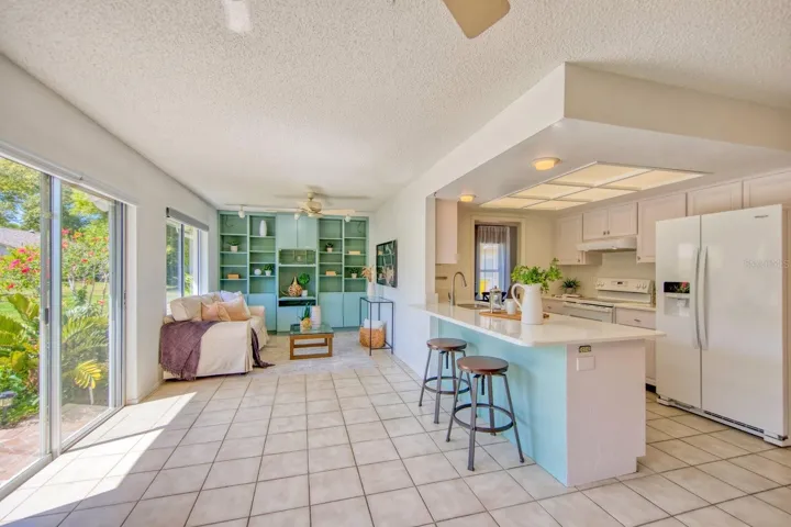 Opens to family room with additional built in cabinets & shelves~