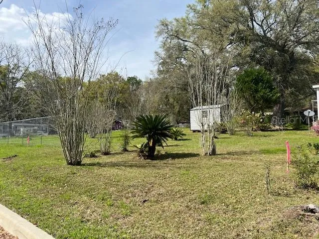 Lot is an interior lot, which is bordered by two corner lots which are also for sale on separate listings. Shed pictured does not convey.
