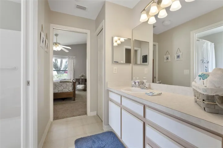 Jack & Jill Guest Bathroom features a linen closet