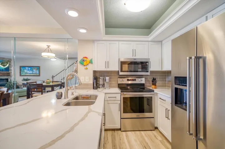 Kitchen, Dining Room, and Family Room with luxury vinyl plank flooring throughout.