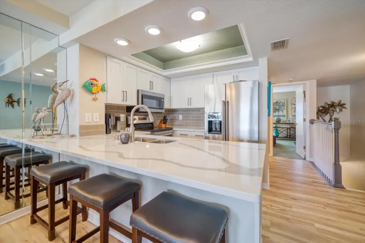 Beautifully updated Kitchen with soft-close cabinets, Quartz Countertops, and stainless steel applicances.