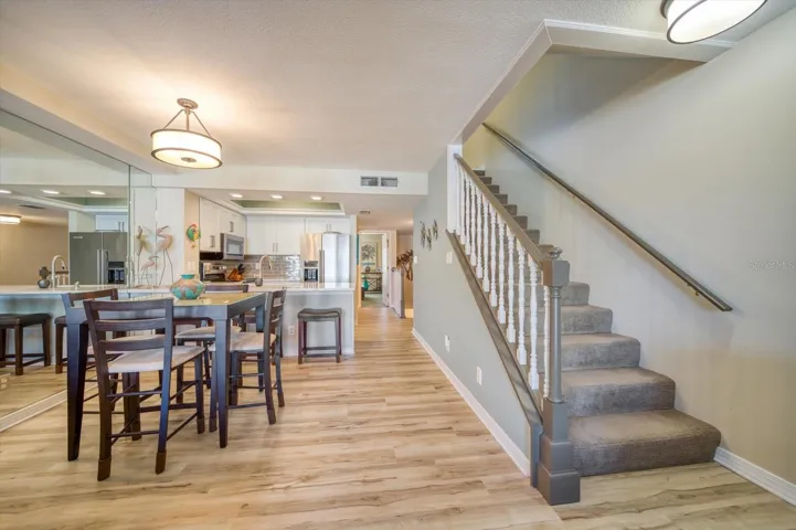 Looking back towards the Kitchen and Dining Room. There is a bedroom and full bathroom on this level as well.