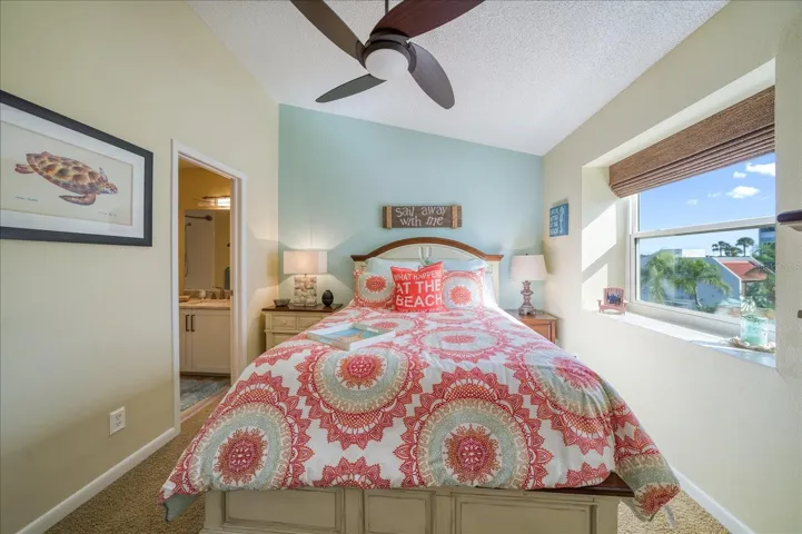 3rd Bedroom with vaulted ceilings and an ensuite bathroom.