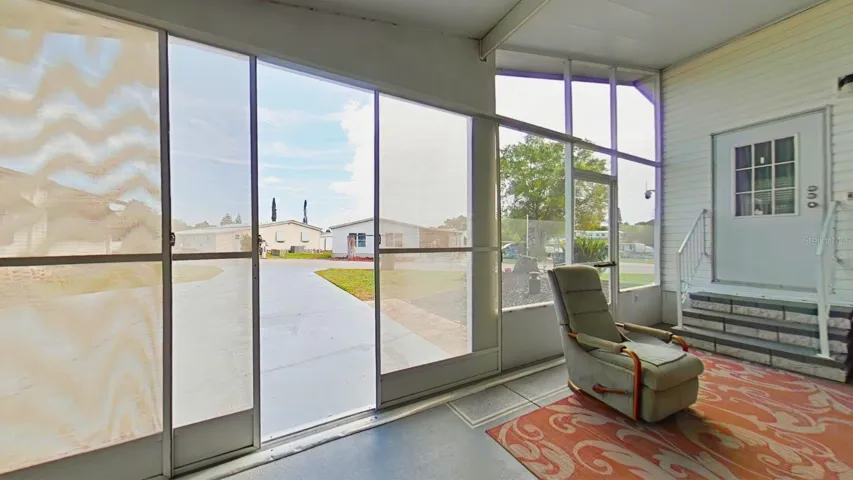 Screened door to the car port