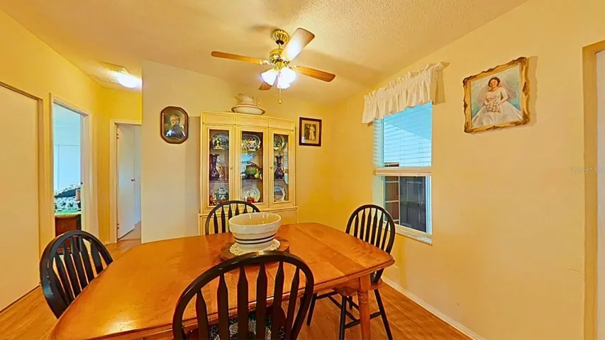 Right off the kitchen, convenient for hosting.