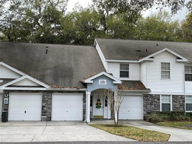 Front of building. Garage and Main Entry.