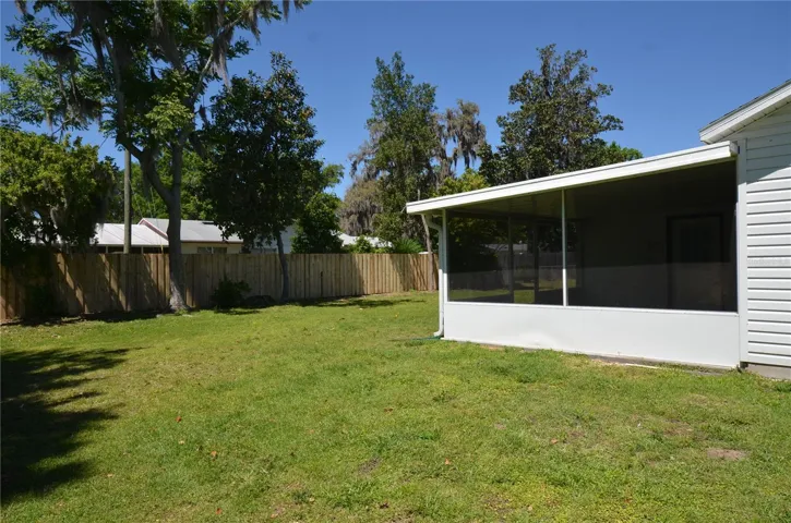 side yard with screen room