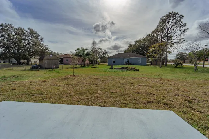 BACK PATIO TO ENTERTAIN ON YOUR .30 ACRE CORNER LOT.