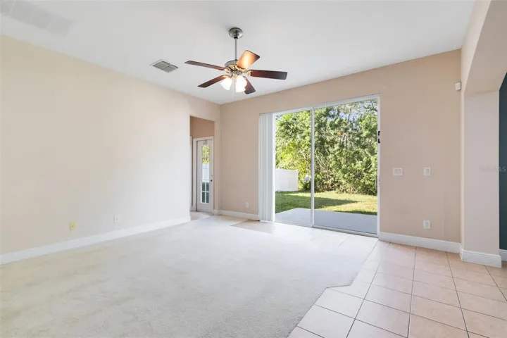 Sliding glass doors in the family room open up to a wonderful patio space.