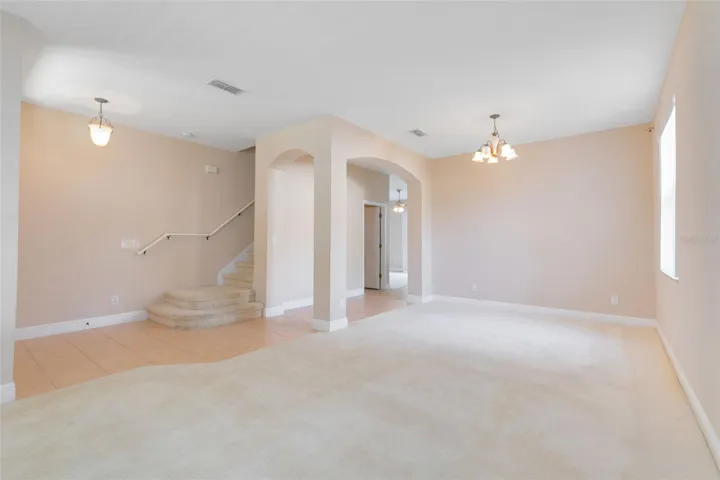 A view from the formal living room into the formal dining room.