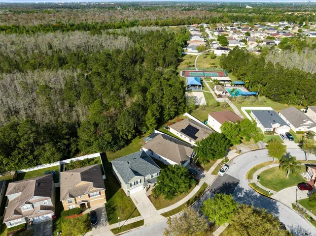 Aerial view of the home with community amenities to the west.