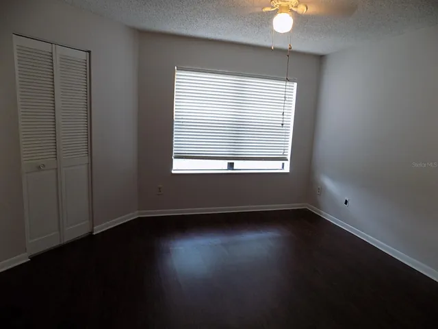 Primary bedroom with laminate floors